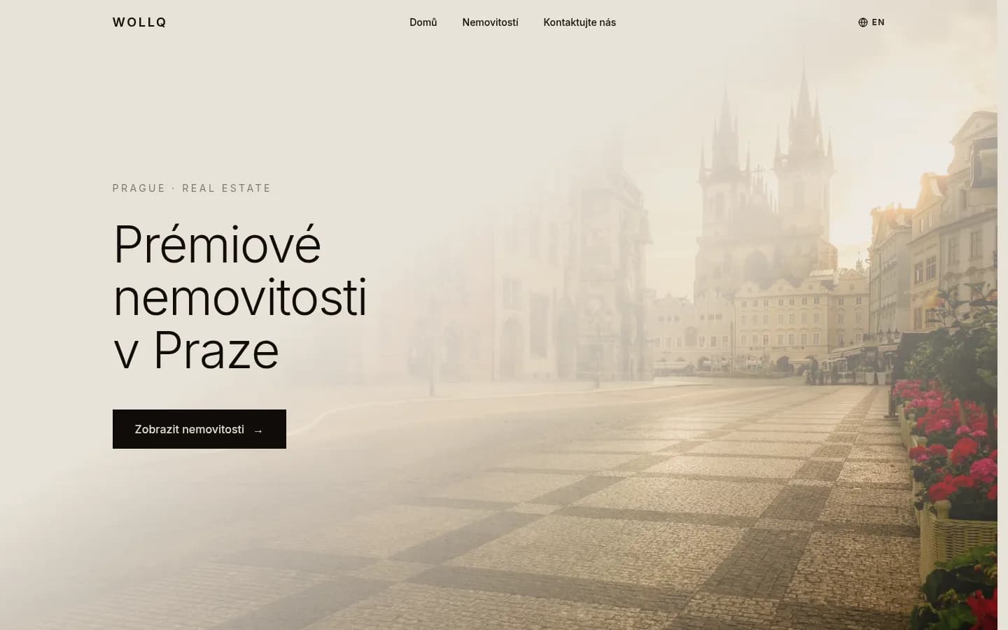 Úvodní stránka webu Wollq s nabídkou prémiových nemovitostí v Praze